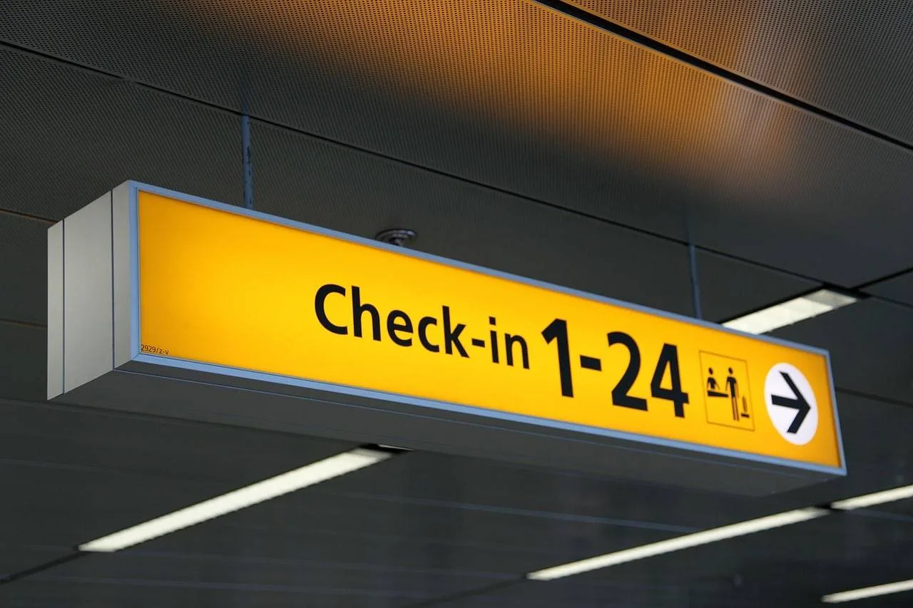 Riyadh Airport wayfinding signage project in Saudi Arabia showing directional signage and construction hoarding by Kaiian Agency