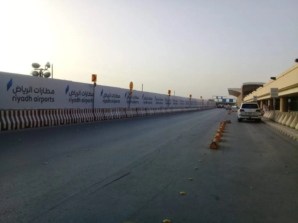 Wayfinding signage project at Riyadh Airport in Saudi Arabia showing directional signage and branded construction hoarding by Kaiian Agency